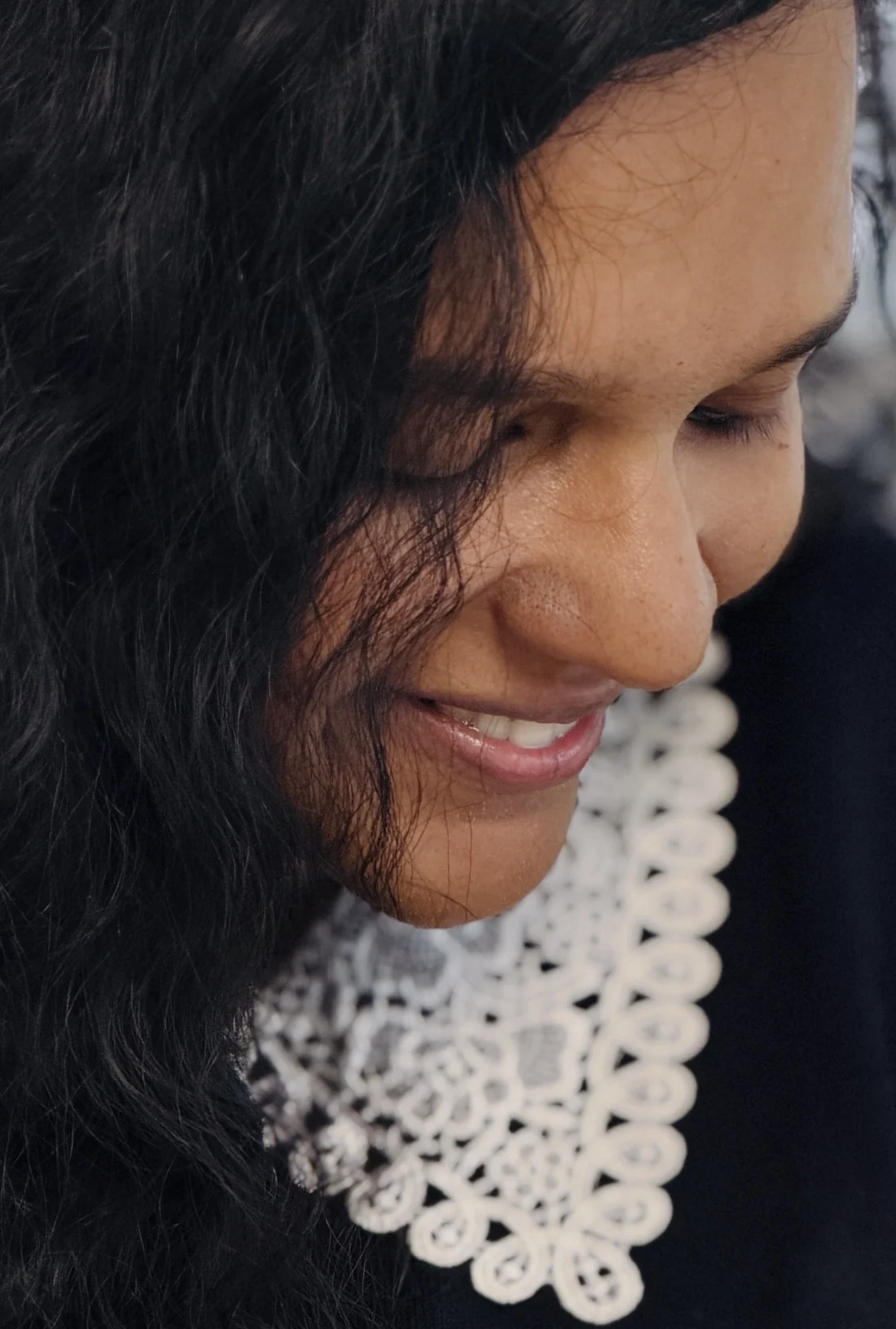 Harsha Mary Sunny smiling softly, in a candid close portrait